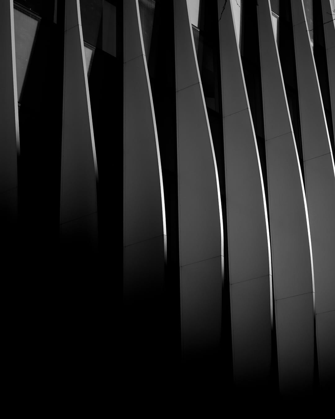 Curved facade panels
