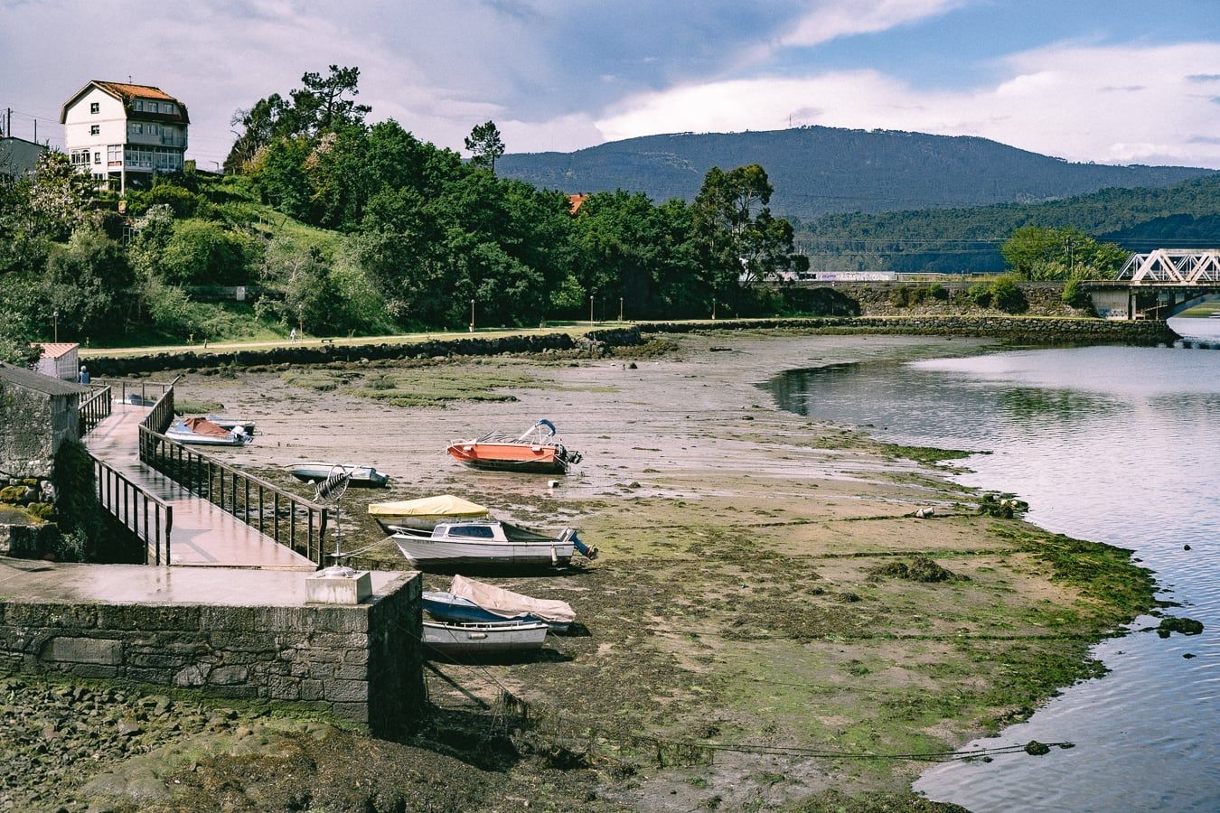 Boats in an estuary at low tide