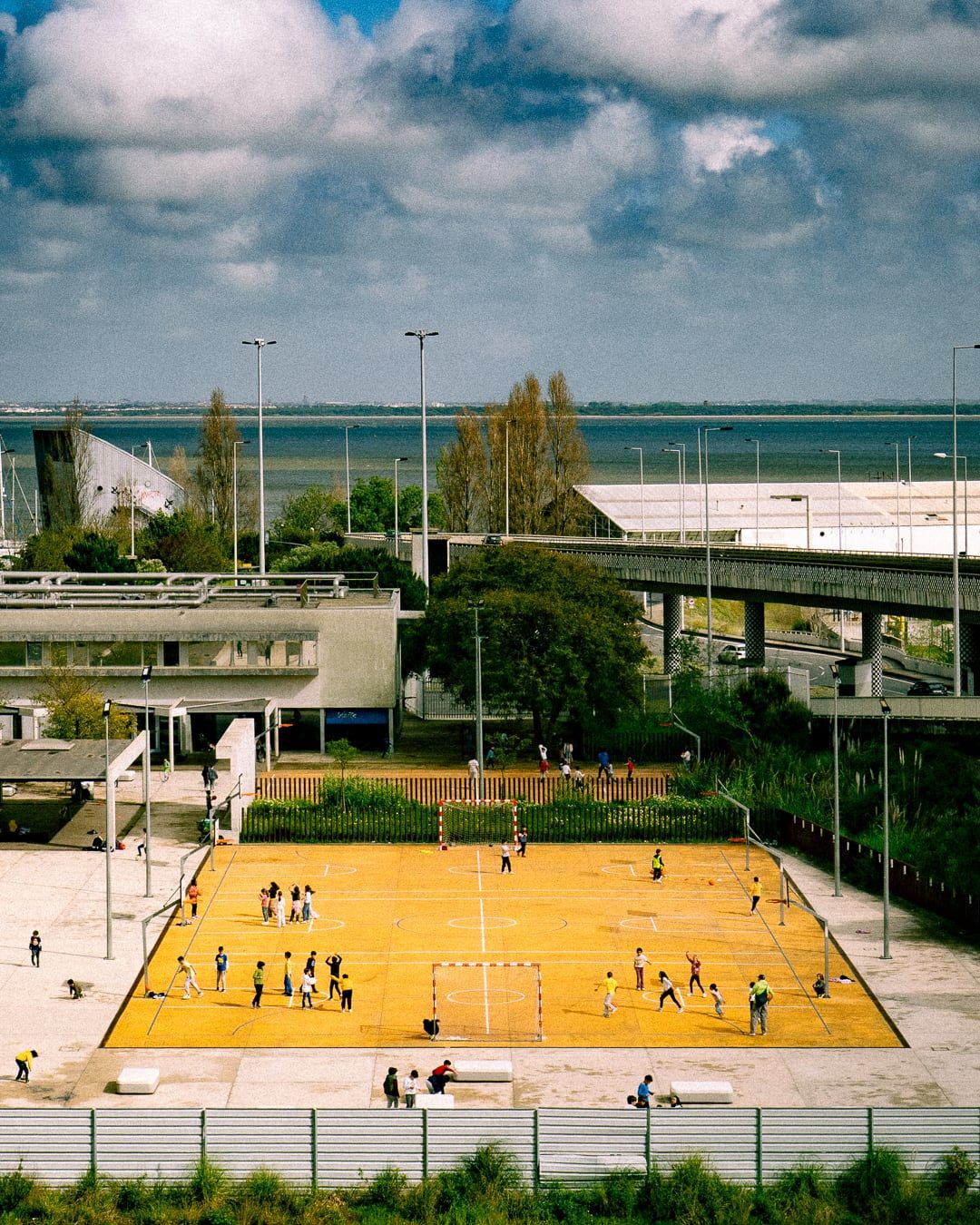A yellow football court seen from above