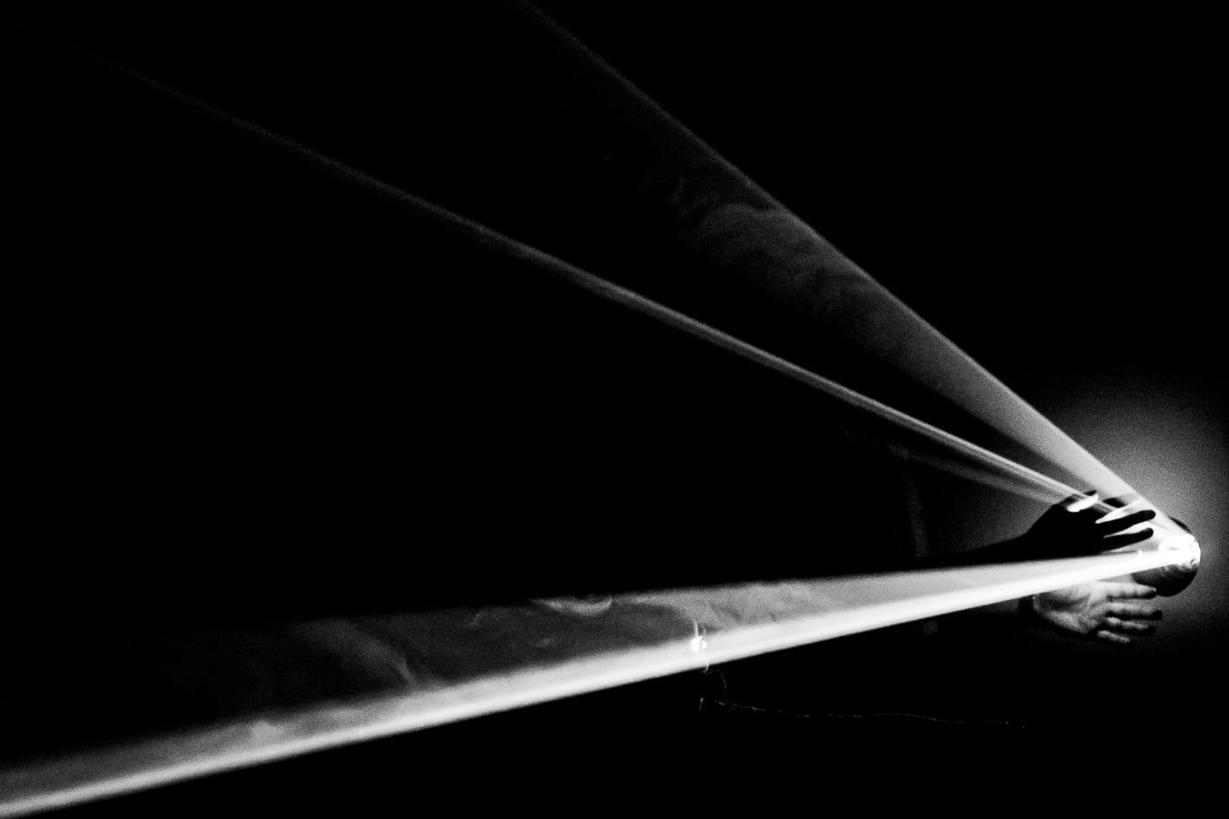Beams of light cutting through the dark