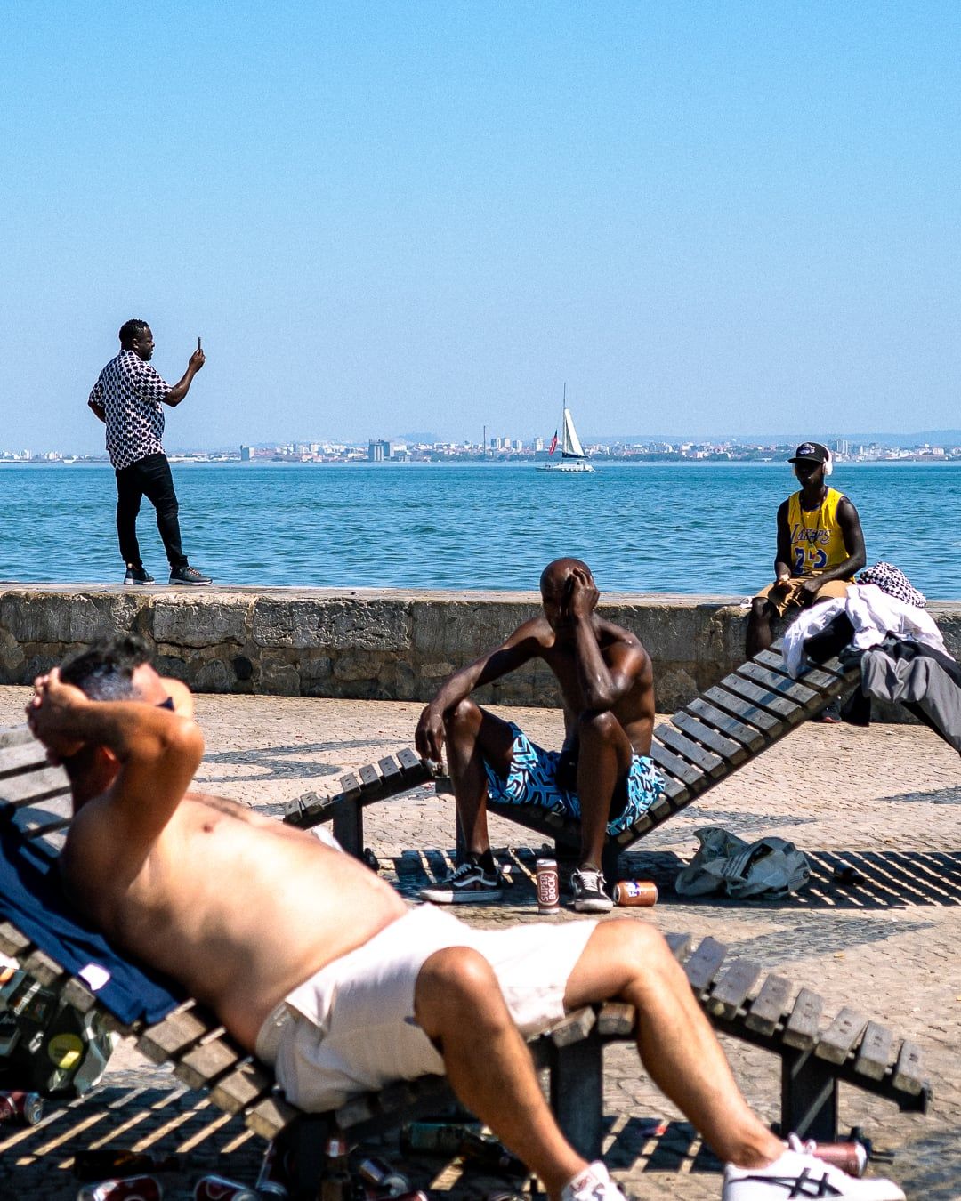 Sunbathers on a seawall