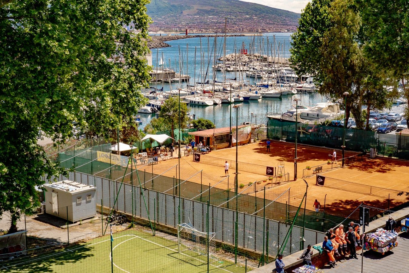 Tennis courts beside a marina