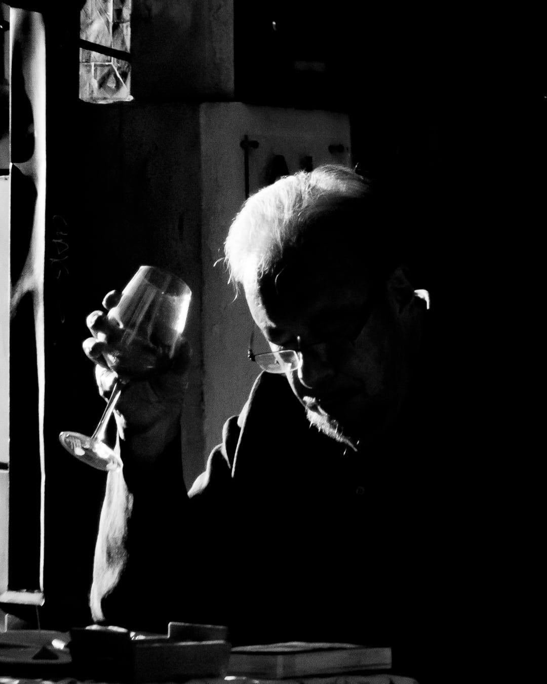 A man holding a glass of wine
